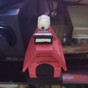 It's Snoopy  Dog. house with Snoopy. And a typewriter on top.